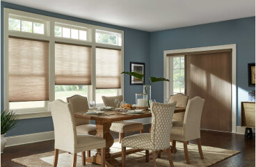 Honeycomb Shades on windows in a brightly lit dining room